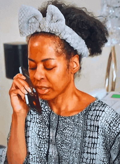 Woman With Headband Talking On Phone GIF