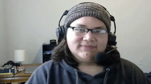 Woman With Headphones And Beanie Smiling GIF