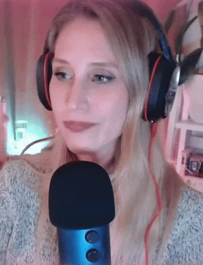 Woman With Headphones and Blue Microphone