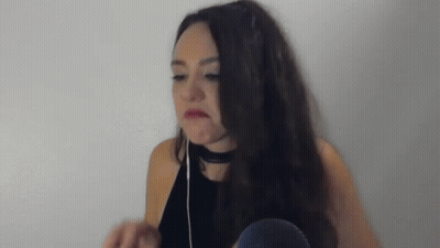 Woman With Headphones And Choker Making Funny Face GIF
