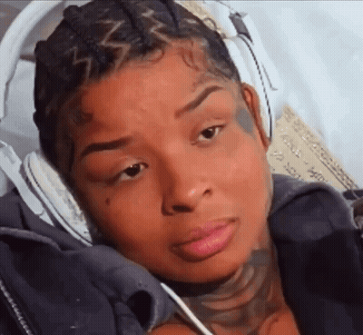 Woman With Headphones and Face Tattoo