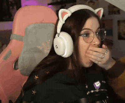 Woman With Headphones And Glasses Covering Mouth GIF