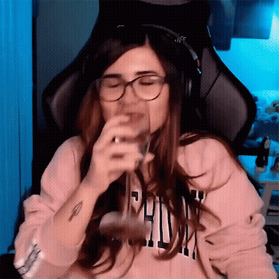 Woman With Headphones And Glasses Drinking From Glass GIF