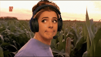 Woman With Headphones And Mic Making Face In Field GIF