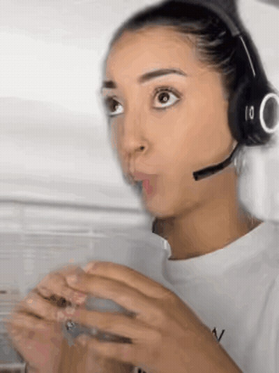 Woman With Headphones And Microphone Holding Coffee GIF