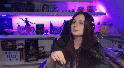 Woman With Headphones At Microphone In Purple Lights GIF