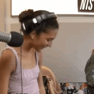 Woman With Headphones At Microphone GIF