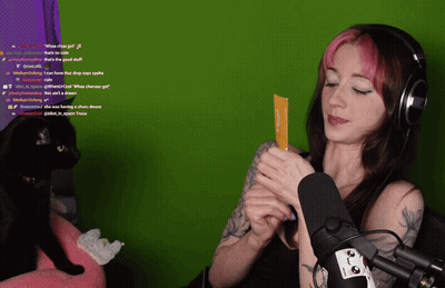 Woman With Headphones Holding What The Girl Card GIF
