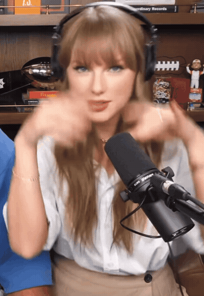 Woman With Headphones In Front Of Taylor Swift Microphone GIF
