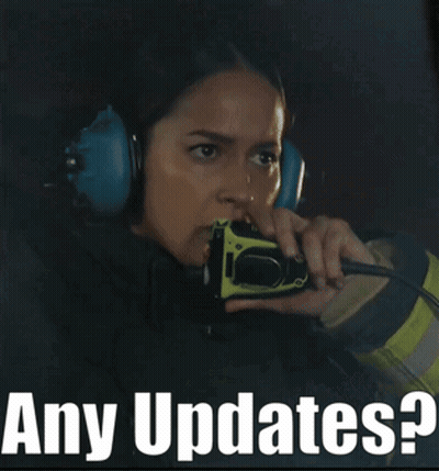 Woman With Headphones On Walkie Talkie Saying Any Updates GIF