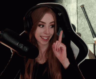 Woman With Headphones Pointing Upwards At Microphone GIF
