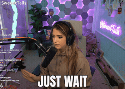 Woman With Headphones Saying Just Wait GIF