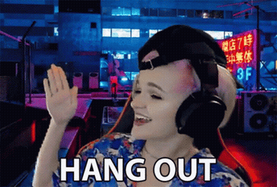 Woman With Headphones Says Hang Out In Front Of Building GIF