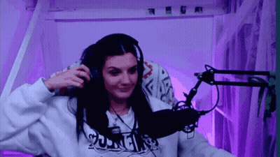 Woman With Headphones Smiling At Microphone GIF