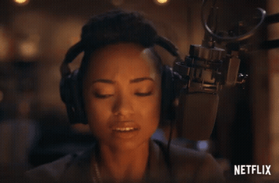 Woman With Headphones Speaking Into Microphone Netflix