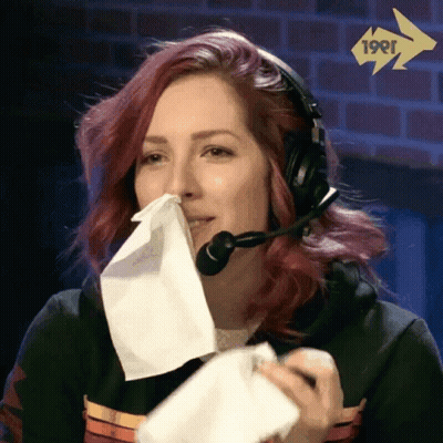 Woman With Headset Blowing Nose GIF