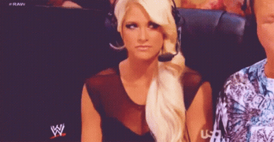 Woman With Headset In Front Of WWE Logo GIF