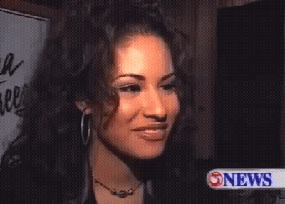 Woman With Hoop Earrings And Necklace Close Up GIF