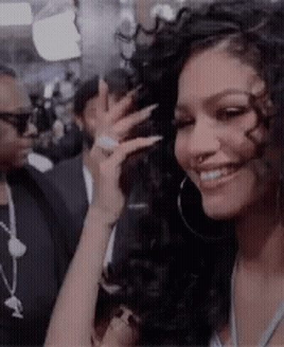 Woman With Hoop Earrings And Nose Ring Smiling GIF