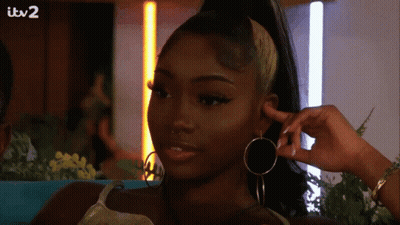 Woman With Hoop Earrings And Ponytail ITV 2 GIF