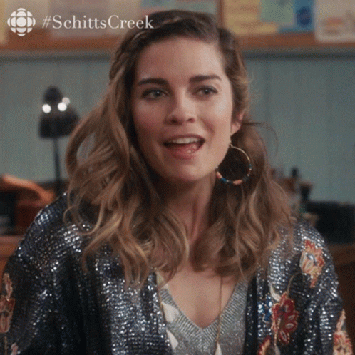 Woman With Hoop Earrings And Sequined Jacket Schitts Creek GIF