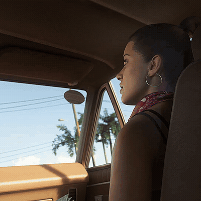 Woman With Hoop Earrings Sits In Car GIF