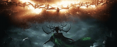 Woman With Horns And Green Cape In Front Of Birds GIF