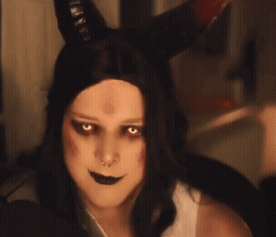 Woman With Horns Making Devil Face Pointing Up GIF