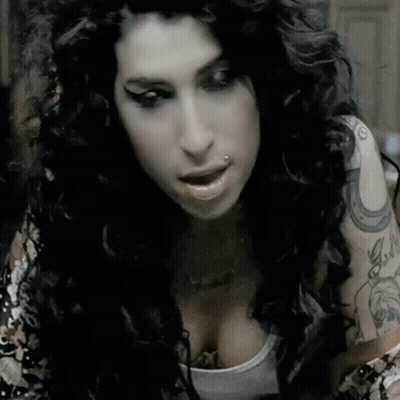 Woman With Horseshoe Tattoo On Shoulder GIF