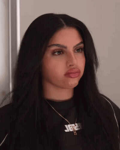 Woman With Jesus Necklace Making Funny Face GIF