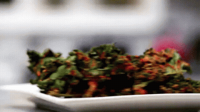 Woman With Kale Chips On Nose GIF