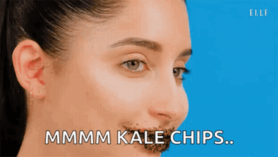 Woman With Kale Chips On Nose GIF