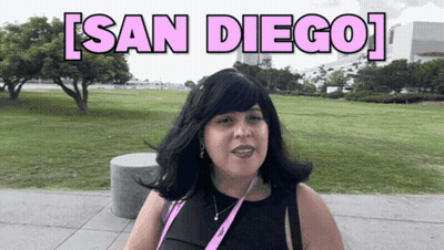 Woman With Lanyard in Park Saying San Diego