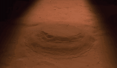 Woman With Large Breasts Looking At Camera GIF