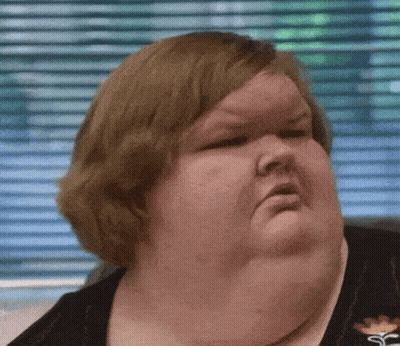 Woman With Large Neck Making Funny Face GIF