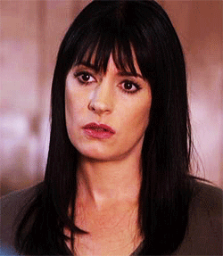 Woman With Long Black Hair And Bangs GIF