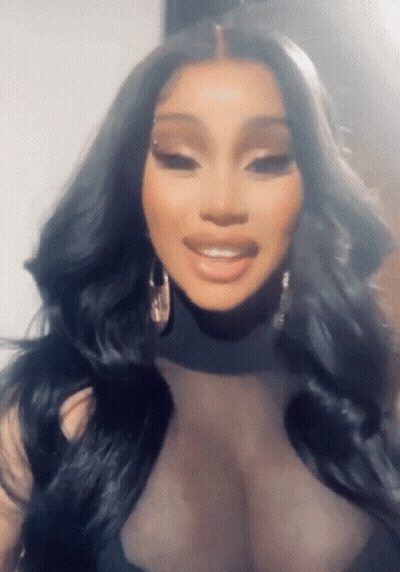 Woman With Long Black Hair And Earrings GIF