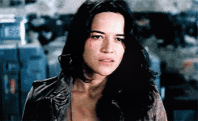 Woman With Long Black Hair And Leather Jacket GIF