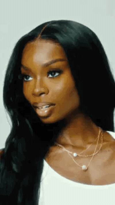 Woman With Long Black Hair And Nose Ring In White Tank Top GIF