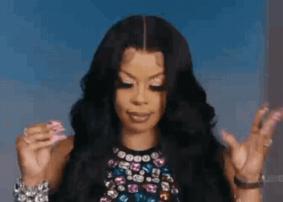Woman With Long Black Hair And Pink Nails Making Funny Face GIF