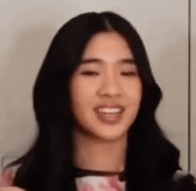 Woman With Long Black Hair And Pink Shirt GIF