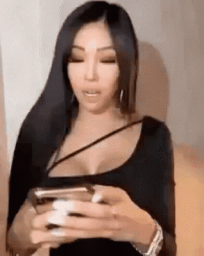 Woman With Long Black Hair Holding Cell Phone GIF