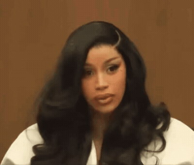 Woman With Long Black Hair Holding Hair GIF
