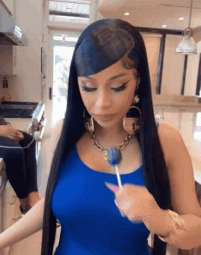 Woman With Long Black Hair Holding Lollipop GIF