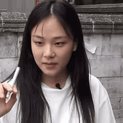 Woman With Long Black Hair Holding Pen GIF
