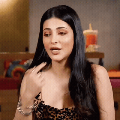 Woman With Long Black Hair In Leopard Print Dress And Bracelet GIF