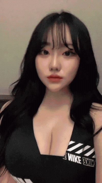 Woman With Long Black Hair In Nike Tank Top GIF