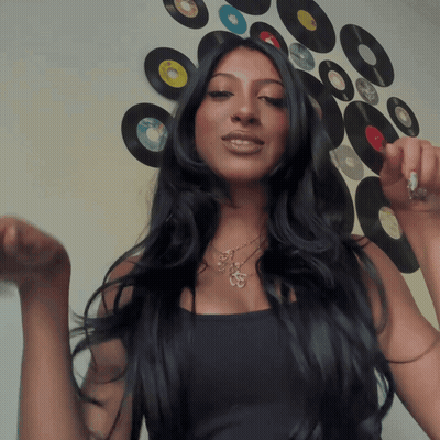 Woman With Long Black Hair In Record Wall GIF