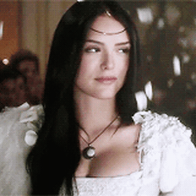 Woman With Long Black Hair In White Dress And Necklace GIF