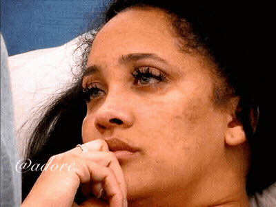 Woman With Long Black Hair In White Sweater And Earrings GIF